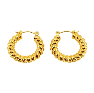 Detailed view of gold twisted croissant hoop earrings with polished metallic texture