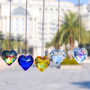 Set of five multi-colored heart-shaped crystal suncatchers with faceted light refraction