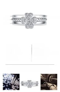 Detailed view of white gold adjustable ring with clover motif and micro-paved zircons