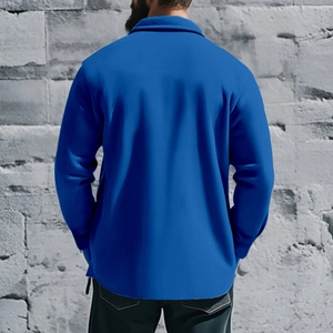 Back view of a durable royal blue men's fleece-lined jacket with a refined shirt collar