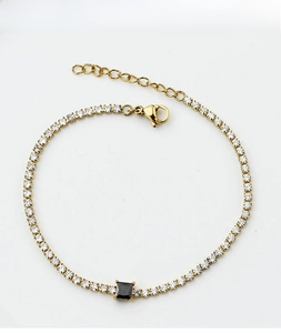 Detail of titanium steel gold bracelet with square black gemstone and pavé cubic zirconia