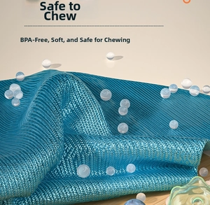 Macro detail of textured blue fabric and soft BPA-free silicone feeder nipple for babies