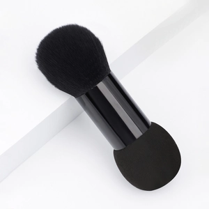 Dual-ended makeup tool with fluffy black powder brush and makeup sponge applicator