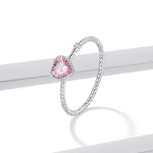 S925 sterling silver twist ring featuring a pink heart-shaped zircon and side stone