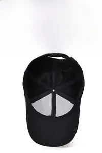 Interior view of black baseball cap showing six-panel stitching and breathable fabric