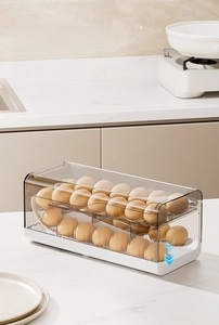 Close-up of double-layer rolling egg tray with gravity feed and clear cover