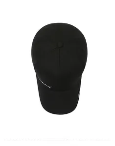 Detailed top view of black cotton baseball cap showing white cursive letter embroidery