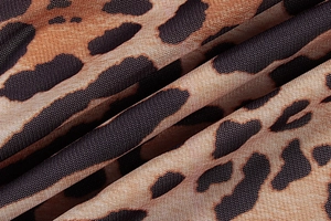 Close-up of leopard print fabric texture on a slim-fit deep V-neck fashion dress