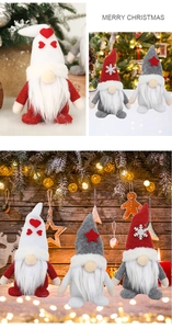 Detail of Christmas gnomes with heart and star patterns against festive warm lights