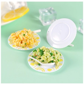 Detailed view of miniature fried rice resin models on tiny white decorative plates