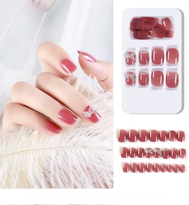 Detailed set of 24 red press-on nails featuring cat eye effect and 3D butterfly accents
