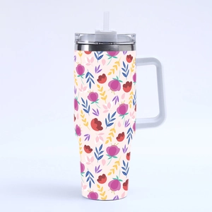 Detail of 40oz stainless steel tumbler featuring pink floral and yellow leaf patterns
