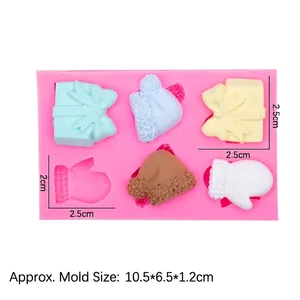 Pink silicone mold with Christmas gift box and Santa hat shapes for fondant or clay