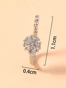 Macro view of silver U-shaped nose ring with heart flower and zircon inlay 1.1cm