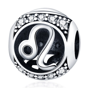 Macro shot of silver Leo zodiac charm with sparkling cubic zirconia for DIY jewelry