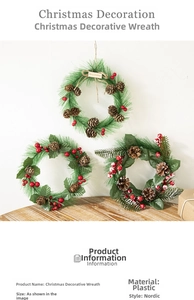 Detail of Christmas wreath set with natural pine cones, red berries and green pine needles
