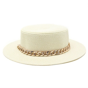 Detail of cream boater straw hat featuring a chunky gold chain link band decoration