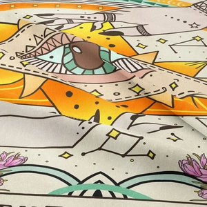 Close-up of bohemian tarot tapestry fabric showing intricate woven texture and mystic motifs