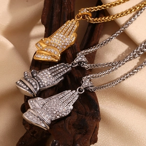 Hip hop 18K gold and silver plated praying hand pendants with cuban chains on silk background
