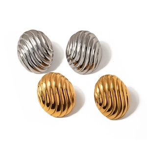 Boucles d'oreilles ovales texturées en or et argent polis avec motifs en spirale