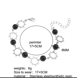 Detail showing 8mm black beads and stainless steel sun pendant bracelet dimensions