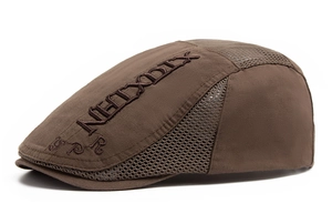 Detail view of coffee brown breathable mesh panels and embroidery on beret hat