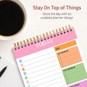 Macro shot of daily spiral planner showing functional layout and colorful sections