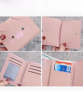 Detailed interior of pink pig cartoon wallet showing card slots and ID window