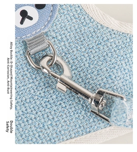 Detail of blue pet harness featuring a rust-proof alloy D-ring and secure safety clasp