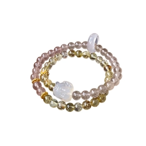Beaded crystal bracelet with purple and champagne beads and white jade pendant
