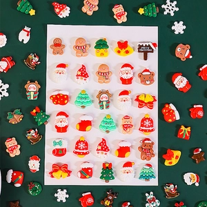 Christmas resin DIY accessory kit with Santa, trees, and ginger man on green background
