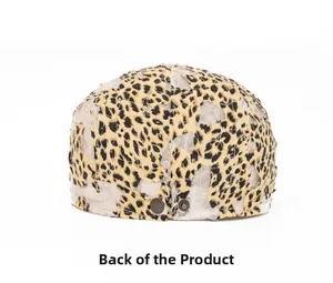 Rear view of leopard print mesh newsboy hat featuring metal buckle and distressed details