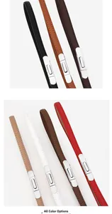 Detail showing various colors of slim leather belts for women with polished metal buckles