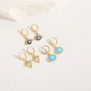 Three-piece gold evil eye earring set with blue enamel and sparkling zircon accents