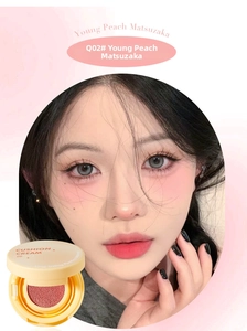 Close-up of cushion blush in bright yellow case with vibrant peach pink shade Q02