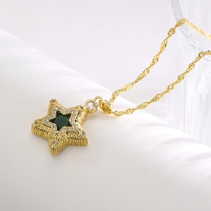 Gold star pendant necklace with green crystal and zircon stones on a water wave chain