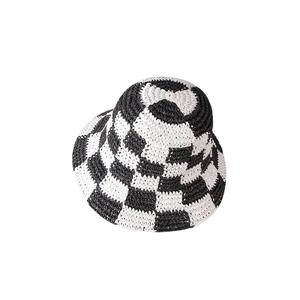 Women's hand-woven checkerboard straw bucket hat with black and white knit pattern
