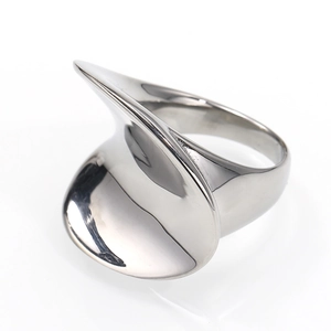 Close-up of polished silver titanium steel ring with asymmetric curved disc design