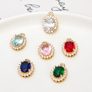 Oval crystal pendant with gold plating and cubic zirconia border for jewelry making