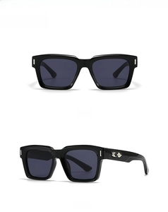 Front and 45-degree side views of classic black square sunglasses with metal rivets