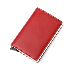 Macro shot of red leather RFID blocking wallet with aluminum card box and pop-up slide