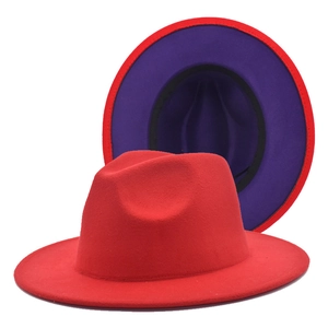 Detail view of the red and purple two-tone wide-brim fedora hat in soft felt texture