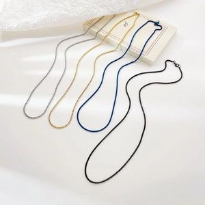Elegant box chain necklaces in gold, silver, blue, and black finishes for women