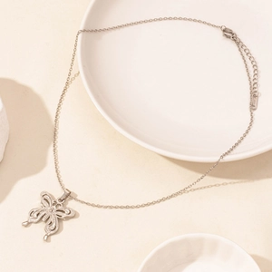Detailed macro of stainless steel butterfly pendant with S-STEEL hallmark engraving