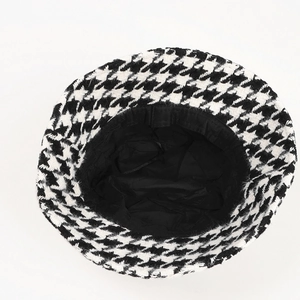 Classic black and white houndstooth bucket hat with thick winter-ready woven texture