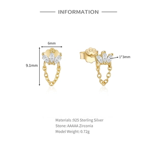 Detailed close-up of S925 sterling silver golden eye stud earrings with cubic zirconia