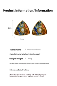 Detail view of 2cm vintage triangle enamel earrings with center pearl and silver needles