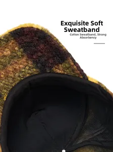 Detailed close-up of fuzzy baseball cap featuring camouflage fleece and black sweatband