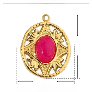 Macro detail of gold stainless steel pendant with oval pink natural stone and leaf carvings