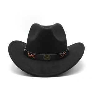 Detail of black felt cowboy hat with leather band and vintage bull head emblem